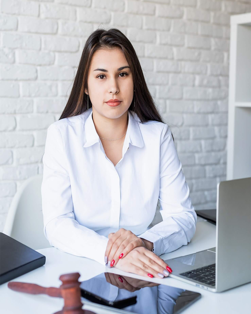 portrait-of-young-female-lawyer-at-her-workplace-1-e1775451830390